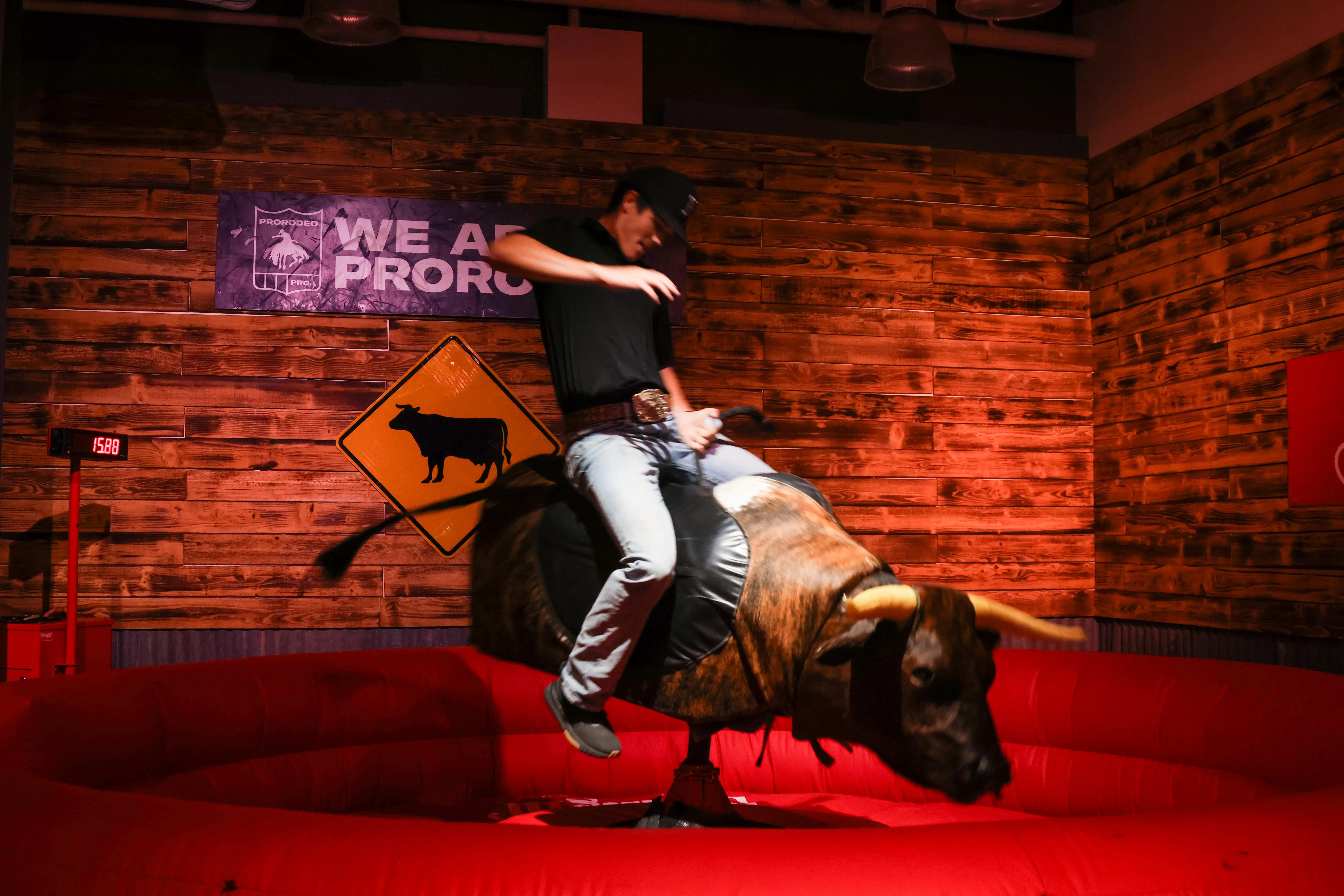 Person riding mechanical bull at a Utah party or birthday event